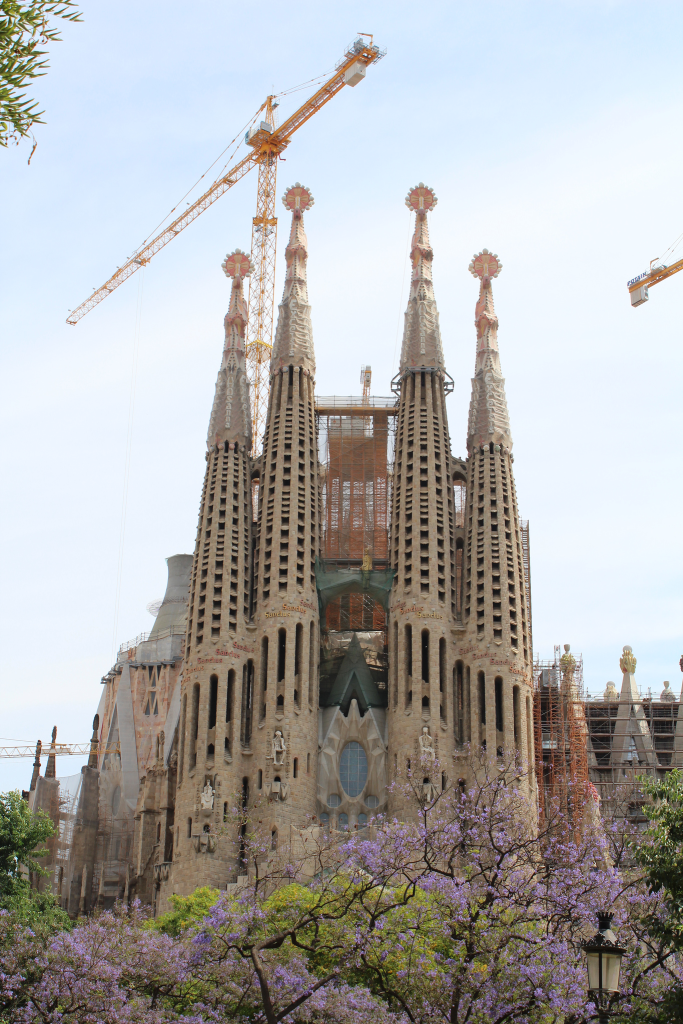 Exterior view with spires of the Sagrada Familia. Taken by Sarah Joy via Flickr.