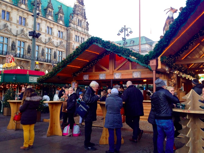 People having drinks at Hamburg Rathaus Christmas Market.