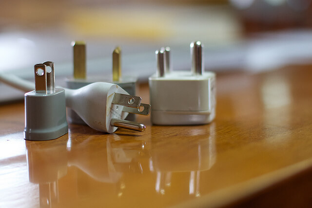 Power adapters for international outlets. Taken by Alen Levine via Flickr.